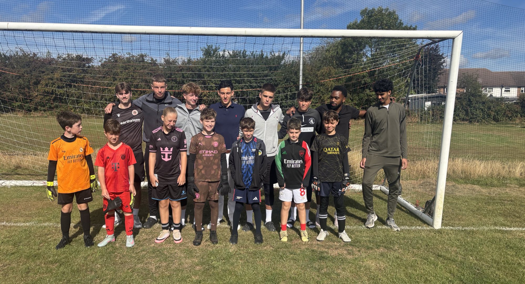 HFC players and coaches together in front of a goal at a recent session